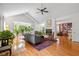 Spacious living room with fireplace, hardwood floors, and expansive windows at 5108 Riverview Dr, Indianapolis, IN 46208