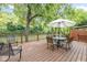 Expansive deck overlooking the river, featuring outdoor seating and a dining area, creating an ideal retreat at 5108 Riverview Dr, Indianapolis, IN 46208
