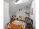 Playroom filled with natural light from a skylight, featuring hardwood floors and whimsical decor at 5108 Riverview Dr, Indianapolis, IN 46208