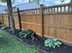 Well-maintained backyard fence with flower bed and lush greenery around the perimeter at 537 N 17Th St, Noblesville, IN 46060
