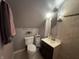 Bathroom with an angled ceiling, decorative mirror, and plenty of storage at 537 N 17Th St, Noblesville, IN 46060