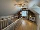 Large bonus room features unique architectural elements, a ceiling fan and lots of sunlight at 537 N 17Th St, Noblesville, IN 46060