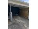 Spacious carport featuring a wooden accent wall and providing ample covered parking at 537 N 17Th St, Noblesville, IN 46060