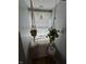 Small reading nook featuring lots of natural light and hanging plant decor at 537 N 17Th St, Noblesville, IN 46060