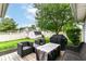 This backyard offers a cozy seating area and a grill, perfect for outdoor entertaining at 5651 Pine Knoll Blvd, Noblesville, IN 46062
