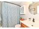Bathroom featuring patterned shower curtain, medicine cabinet, and sink at 5651 Pine Knoll Blvd, Noblesville, IN 46062