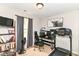 This bedroom features an exercise area and a comfortable workspace with natural light at 5651 Pine Knoll Blvd, Noblesville, IN 46062