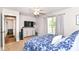 Bedroom featuring a window, closet, and dresser with TV at 5651 Pine Knoll Blvd, Noblesville, IN 46062