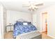 Bedroom features a blue floral comforter and gray storage bench at 5651 Pine Knoll Blvd, Noblesville, IN 46062