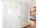 Welcoming entryway with a modern front door and a glimpse into a cozy bedroom at 5651 Pine Knoll Blvd, Noblesville, IN 46062