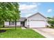Inviting single-story home with landscaped front yard and a convenient two-car garage at 5651 Pine Knoll Blvd, Noblesville, IN 46062