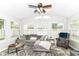 Sunlit living room with large windows, neutral decor, comfortable seating, and a relaxing vibe at 5651 Pine Knoll Blvd, Noblesville, IN 46062