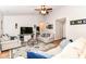 Bright living room with vaulted ceilings, ceiling fan, stylish furnishings, and a cozy atmosphere at 5651 Pine Knoll Blvd, Noblesville, IN 46062