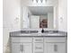 Elegant bathroom featuring a double vanity with granite countertops, modern fixtures, and toilet at 5655 Lighthouse Dr, Brownsburg, IN 46112