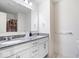 Bright bathroom featuring a double vanity with granite countertops and modern fixtures at 5655 Lighthouse Dr, Brownsburg, IN 46112