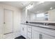 Bright bathroom featuring a double vanity with granite countertops and modern fixtures at 5655 Lighthouse Dr, Brownsburg, IN 46112