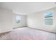 Spacious bedroom with neutral carpeting and ample natural light from a window overlooking the exterior at 5655 Lighthouse Dr, Brownsburg, IN 46112