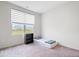 A simple bedroom with a twin bed, shelf, and large window, perfect for minimalist living at 5655 Lighthouse Dr, Brownsburg, IN 46112