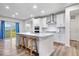 Modern kitchen with stainless steel appliances and large island with bar seating at 5655 Lighthouse Dr, Brownsburg, IN 46112