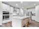 Modern kitchen with stainless steel appliances and large island with bar seating at 5655 Lighthouse Dr, Brownsburg, IN 46112