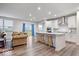 Modern kitchen with stainless steel appliances and large island with bar seating at 5655 Lighthouse Dr, Brownsburg, IN 46112