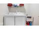 Functional laundry room with washer, dryer, utility sink, and storage, making chores easy at 5655 Lighthouse Dr, Brownsburg, IN 46112