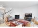 Bright living room featuring a fireplace, large windows, and neutral decor at 5655 Lighthouse Dr, Brownsburg, IN 46112