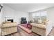 Bright living room featuring a fireplace, large windows, and neutral decor at 5655 Lighthouse Dr, Brownsburg, IN 46112
