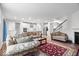 Open-concept living room flows into a modern kitchen with stainless steel appliances at 5655 Lighthouse Dr, Brownsburg, IN 46112