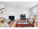 Bright living room featuring a fireplace, large windows, and neutral decor at 5655 Lighthouse Dr, Brownsburg, IN 46112