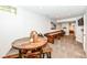 Finished basement featuring a game table, shuffleboard, and neutral carpeting at 5681 Carrollton Ave, Indianapolis, IN 46220
