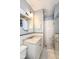 Stylish bathroom features a marble countertop vanity and tiled walk-in shower at 5681 Carrollton Ave, Indianapolis, IN 46220