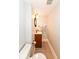 Powder room featuring tile flooring, vanity with sink, and modern lighting at 5681 Carrollton Ave, Indianapolis, IN 46220