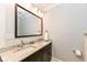 Elegant bathroom with a double vanity, granite countertops, and stylish fixtures at 5681 Carrollton Ave, Indianapolis, IN 46220