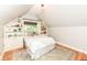 Charming bedroom with built-in shelves, bright window, and decorative accents at 5681 Carrollton Ave, Indianapolis, IN 46220