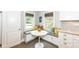 Charming breakfast nook with built-in seating, bright windows, and a cozy atmosphere at 5681 Carrollton Ave, Indianapolis, IN 46220