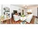 Comfortable living room with modern furnishings, a fireplace, and hardwood floors at 5681 Carrollton Ave, Indianapolis, IN 46220