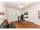 Bright home office with hardwood floors, natural light, and a comfortable workspace at 5681 Carrollton Ave, Indianapolis, IN 46220