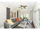 Cozy sun room featuring comfortable seating and plenty of natural light at 5681 Carrollton Ave, Indianapolis, IN 46220
