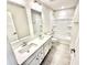 Bright bathroom with double sink vanity, tiled floors, and tub and shower combo at 581 Roosevelt St, Fortville, IN 46040