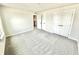 Bright bedroom with plush carpet and double closets, providing ample storage space at 581 Roosevelt St, Fortville, IN 46040