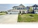 Attractive two-story home with a spacious three-car garage, lovely landscaping, and a welcoming entrance at 581 Roosevelt St, Fortville, IN 46040