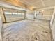 This garage has an unfinished drywall, concrete flooring, and an overhead garage door at 581 Roosevelt St, Fortville, IN 46040