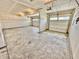 This is a spacious two-car garage with unfinished drywall, concrete floors, and two bays at 581 Roosevelt St, Fortville, IN 46040