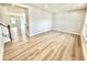 Bright living room with hardwood floors, neutral walls, recessed lighting, and open floor plan at 581 Roosevelt St, Fortville, IN 46040