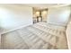 This home's loft has carpeted flooring, neutral walls, and is open to the staircase at 581 Roosevelt St, Fortville, IN 46040