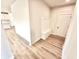 This mudroom has a built-in bench with storage and coat hooks, next to the front door at 581 Roosevelt St, Fortville, IN 46040