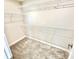 New home featuring a bright walk-in closet with carpeted floors and wire shelving to maximize storage at 581 Roosevelt St, Fortville, IN 46040