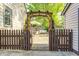 Backyard patio with pergola, dining table, and lounge seating, perfect for outdoor gatherings and relaxation at 6045 Haverford Ave, Indianapolis, IN 46220