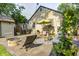 Inviting backyard patio with ample seating, a fire pit, and a charming pergola for outdoor relaxation and entertaining at 6045 Haverford Ave, Indianapolis, IN 46220